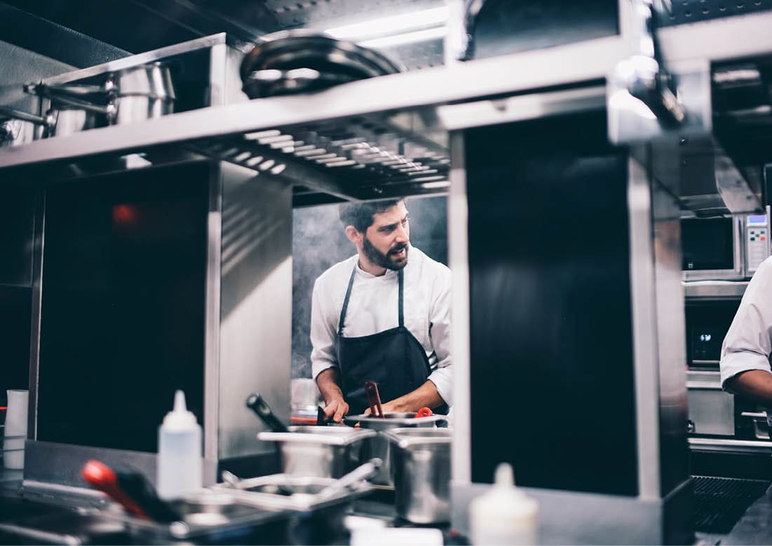 Cook at work in a restaurant kitchen