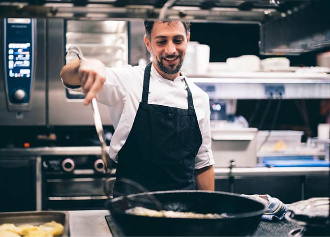 Cook at work in a restaurant kitchen